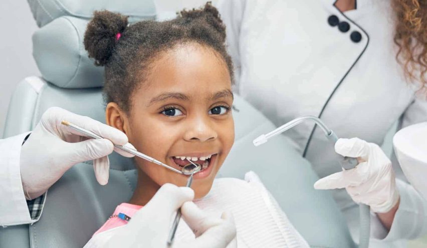 happy-afro-kid-regular-check-up-teeth-dental-clinic-1536x1025-1